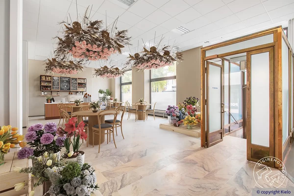 Puistonkulma ensimmäisen kerroksen 206 m2 liiketila, joka on digiremontoitu kukkia täynnä olevaksi kahvilaksi.