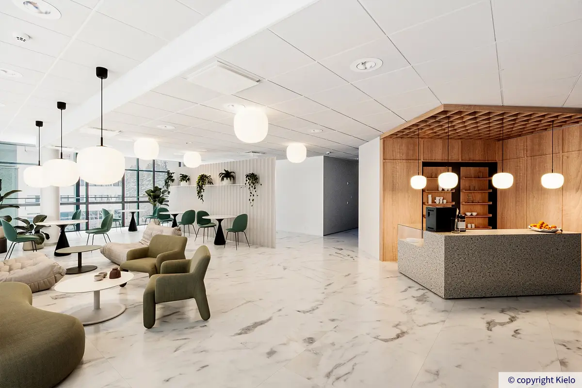 Jyväskylän Ylistönmäentie 26 digiremontoitu neljännen kerroksen 580 m2 toimitila. Kivilaattalalattiaisessa tilassa oleskelutilaa ja puupaneloitu kahvionurkkaus.