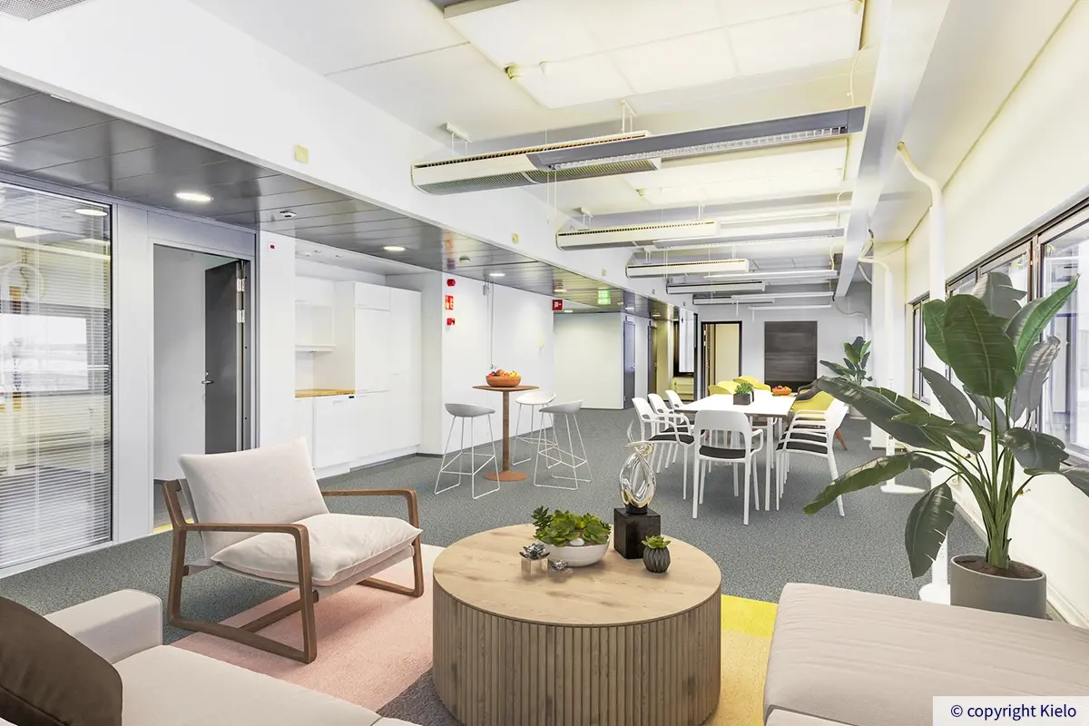 Gate8 Business Park Largossa sijaitseva virtuaalisesti stailattu toimistotila. Avotilassa pöytäryhmä ja sohvia.